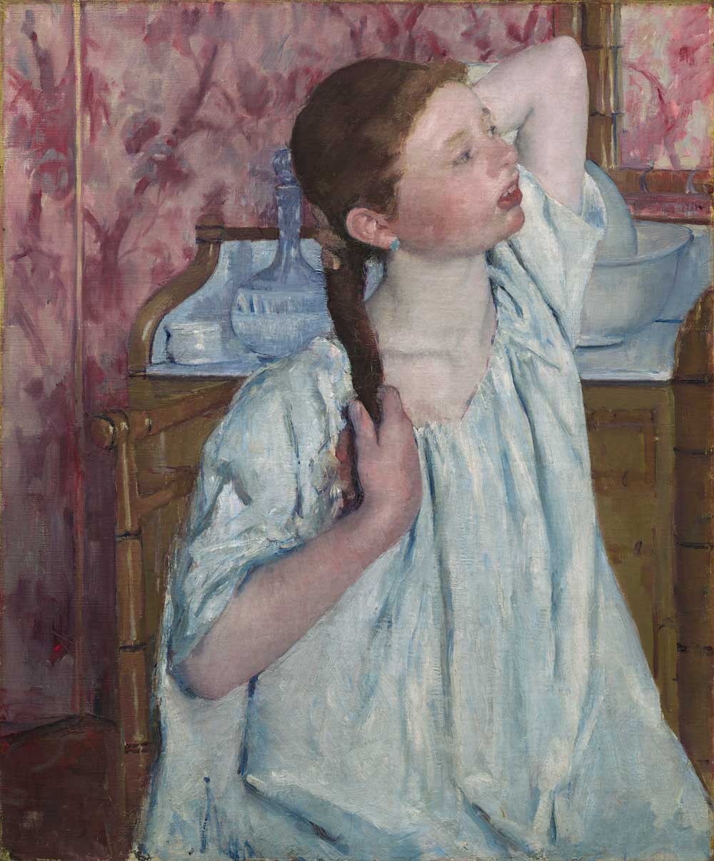 Girl Arranging Her Hair by Mary Cassatt 1886