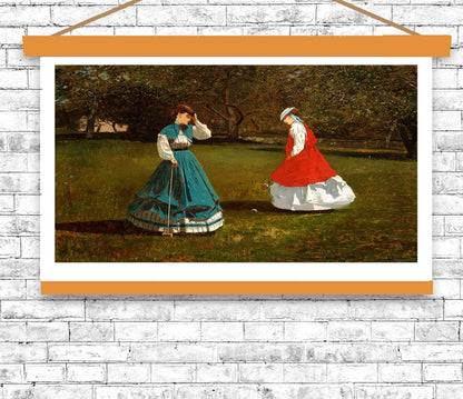 Framed artwork of two women in dresses on a grassy field with a white brick wall background.