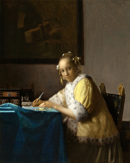 A printed art piece depicting a woman in historical clothing writing a letter, framed in a black frame.