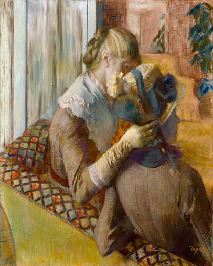 A framed print featuring a woman seated, fitting a mannequin in a milliner's shop, with a decorative border.