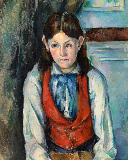 A framed print of 'Boy in a Red Vest' by Paul Cezanne, showing a young boy with a red vest against a muted background.