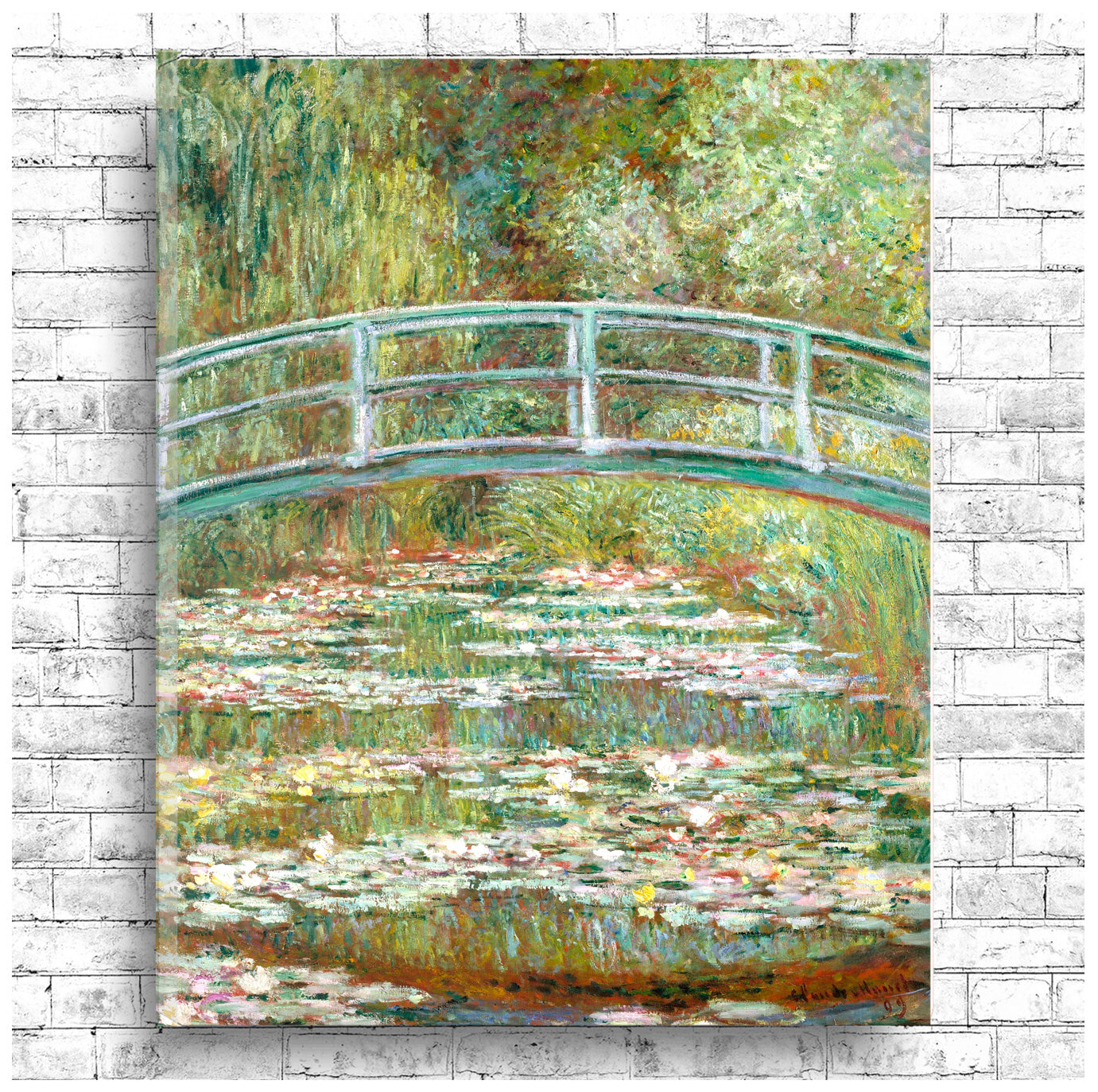 A framed print of 'Bridge over a Pond of Water Lilies' by Claude Monet, depicting a bridge over a pond with surrounding greenery.