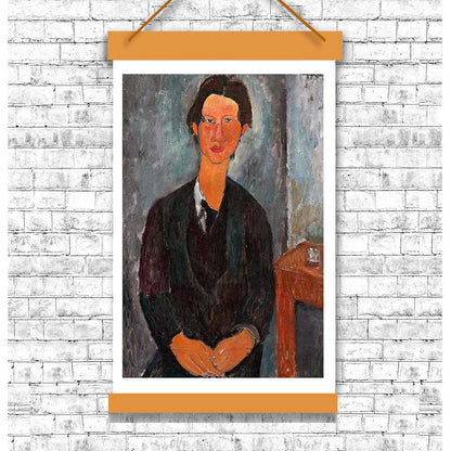A framed portrait painting of a person wearing a dark jacket, with a simple interior background.