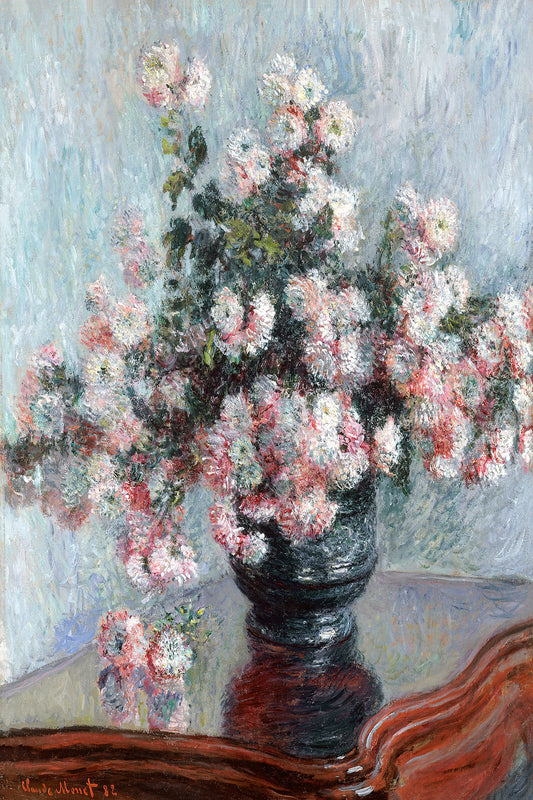 A framed print of 'Chrysanthemums' by Claude Monet, depicting a vase of pink and white flowers on a table.