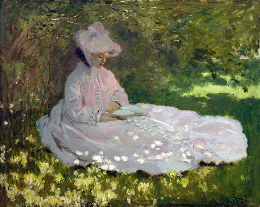 A printed art piece featuring a woman in a pink dress seated in a garden, framed in a black frame.