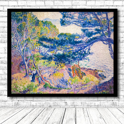 A framed art print featuring a landscape with trees and a path leading to a beach.