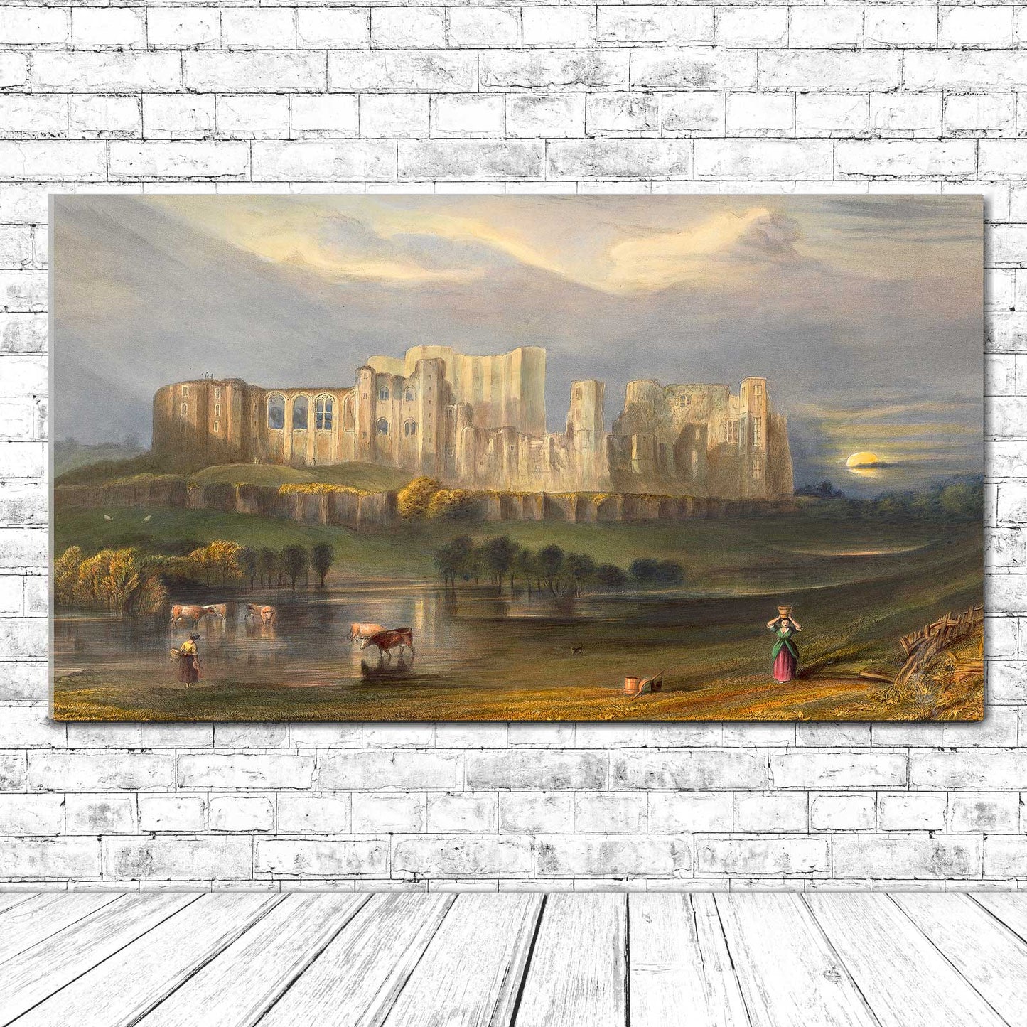 A framed print of Kenilworth Castle with a scenic landscape in the background, available with different mounting options.
