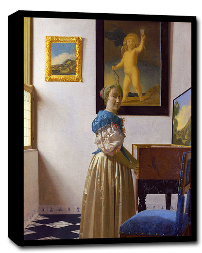 A framed print of 'Lady Standing at a Virginal' by Johannes Vermeer, depicting a woman in historical attire standing near a musical instrument, with a decorative board and a picture of an angel on the wall in the background.