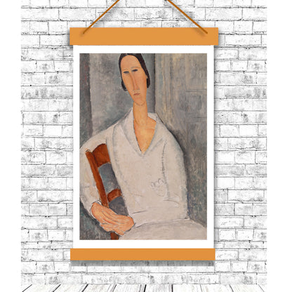 Framed portrait of a woman holding a chair against a white brick wall.