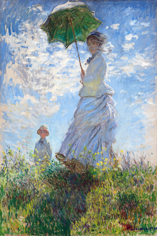 A framed print of 'Madame Monet and Her Son (1875)' by Claude Monet, depicting a woman with a parasol and a child in a grassy field.