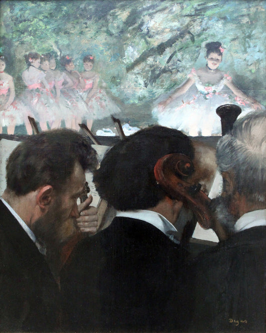A framed print of 'Orchestra Musicians (1872)'' by Edgar Degas, depicting an indoor scene with a focus on the backs of several men in the foreground, with a blurred image of women on stage in the background.