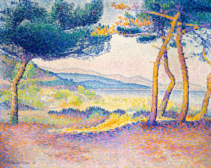 A framed print of a landscape featuring trees and a bright sky, with a visible Artists' signature.