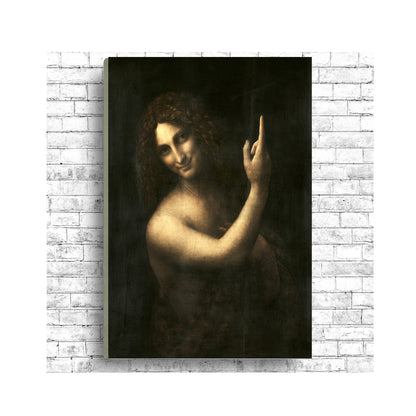 A framed print of 'Saint John the Baptist' by Leonardo Di Vinci, showing the subject with a finger pointing upwards, in a dark and moody portrait style.
