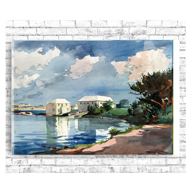 A framed print of a watercolor painting depicting a serene landscape with buildings, water, and trees, under a blue sky with clouds.