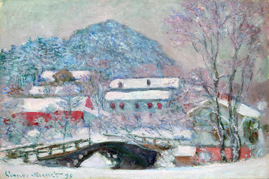 A framed print of a snowy landscape featuring a bridge, buildings, and trees covered in snow, with a solid black frame.