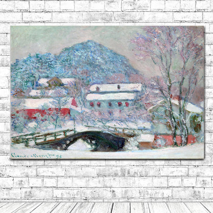 A framed print of a snowy landscape featuring a bridge, buildings, and trees covered in snow, with a solid black frame.