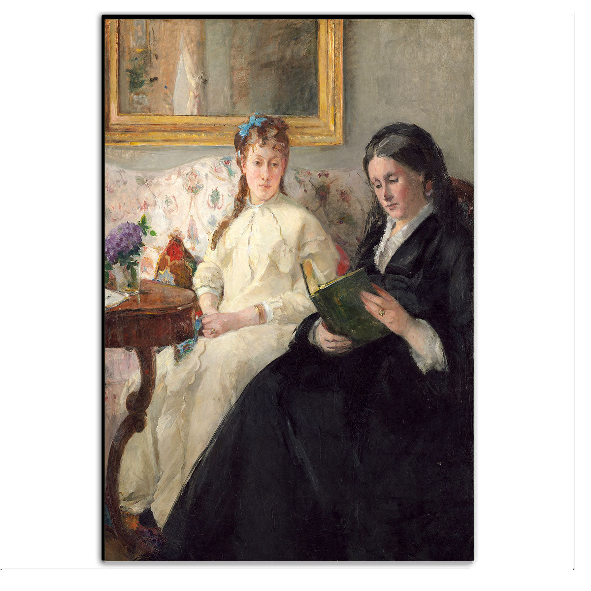 A framed painting depicting two seated women, one younger in white and one older in black, with the older woman reading a book. The artwork is presented in a portrait orientation within a black frame.