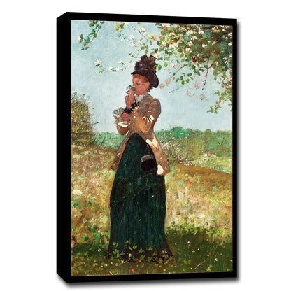 A printed art piece featuring a woman in Victorian clothing standing in a garden, with a black frame around it.