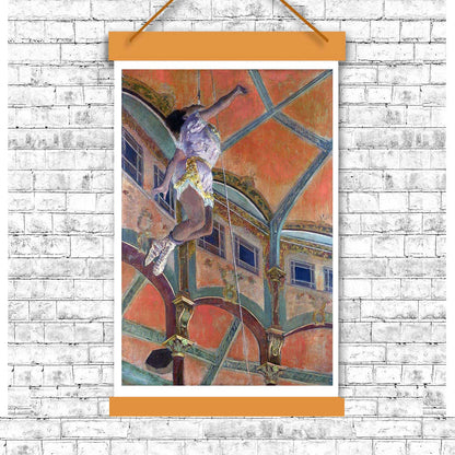 A framed print of 'The Acrobat' by Edgar Degas, depicting a acrobat performing on a tightrope against an architectural backdrop.