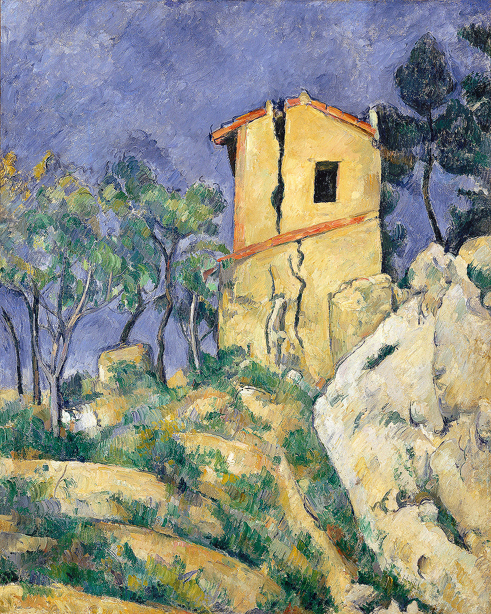 A framed print of 'The House with the Cracked Walls' by Paul Cezanne, depicting a yellow house on a hill with trees in the background.