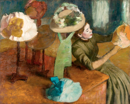A painting depicting a woman seated, trying on a large, decorative hat, with a colorful backdrop and various other hats displayed around her.
