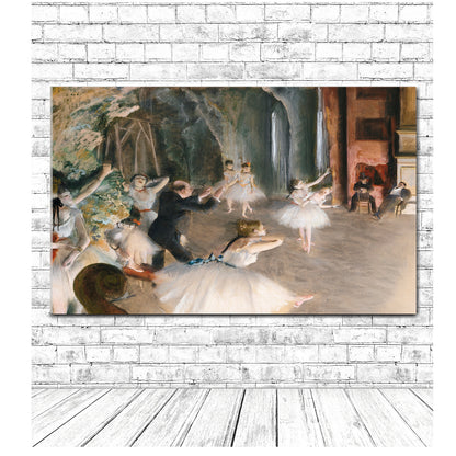 A framed print of 'The Rehearsal Onstage (1874)' by Edgar Degas, depicting a scene with several ballet dancers in a practice room.