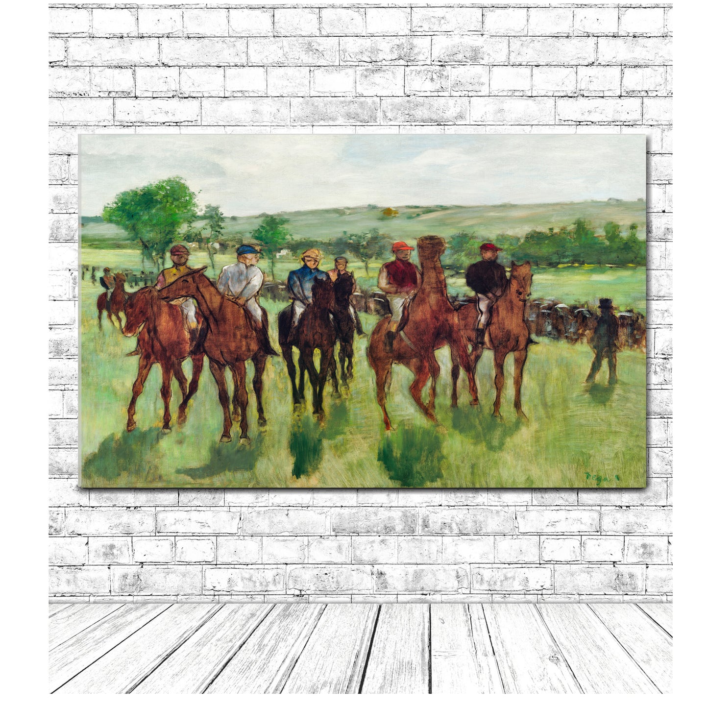A framed print featuring 'The Races' artwork by Edgar Degas, depicting a group of mounted horsemen in a landscape.