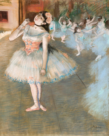 A framed print of a painting depicting ballerinas on stage, with a focus on a primary female figure in the foreground.