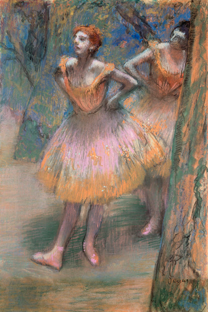 A framed print of 'Two Dancers' by Edgar Degas featuring two ballerinas in pink skirts, with a black frame.