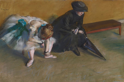 A framed print of 'Waiting' by Edgar Degas featuring two figures, one seated and one standing, in a ballet setting.