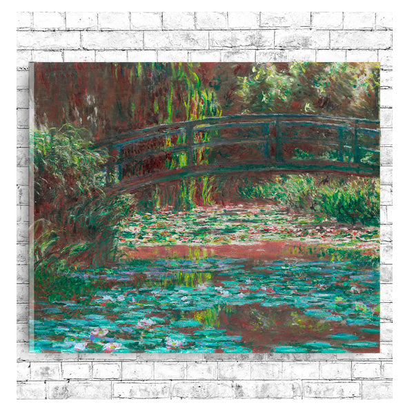 A framed print of 'Water Lily Pond' by Claude Monet, depicting a bridge over a pond with lily pads, surrounded by greenery.