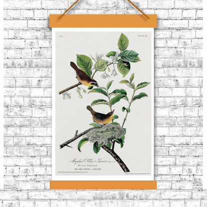 A framed print of a yellow-breasted warbler perched on a branch with green leaves and a white flower in the background, following the portrait orientation.