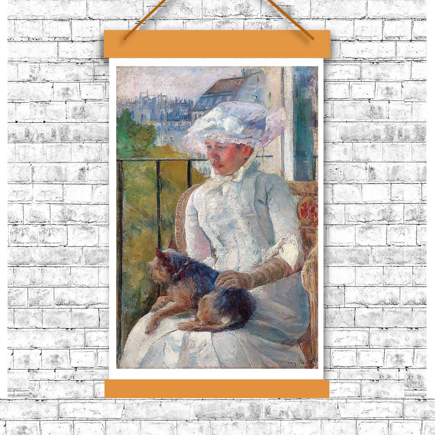 A framed print of a painting depicting a young girl seated at a window, wearing a white hat and interacting with a small dog.