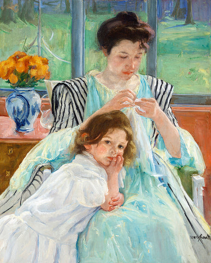 A framed print depicting a mother and child, with the mother sewing. The child is sitting beside her, looking towards the viewer.