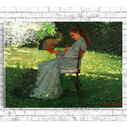 A printed art piece featuring a woman in a blue dress sitting on a bench, reading a book, with a decorative black frame around it.