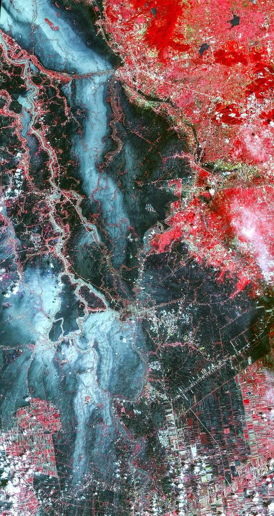 A satellite image of the Ayutthaya River in Bangkok with vibrant red and blue colors, representing different intensities or features on the Earth's surface.