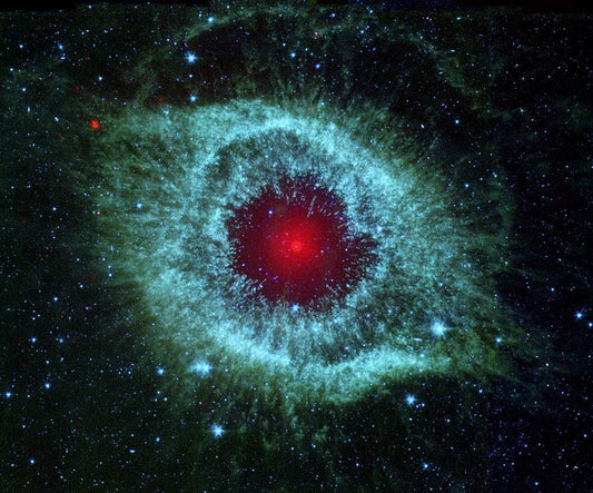 A photographic print of the Red Eye Nebula featuring vibrant red and green colors against a black background, representing a celestial object from outer space.